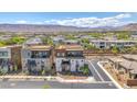 Expansive view of a modern home in a desert community with mountain views in the background at 4153 Solace St, Las Vegas, NV 89135