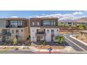 Contemporary home with unique exterior, featuring multiple windows and outdoor balconies at 4153 Solace St, Las Vegas, NV 89135