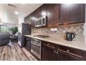 Well-equipped kitchen featuring granite countertops, stainless steel appliances, and modern cabinets at 4650 Ranch House Rd # 86, North Las Vegas, NV 89031