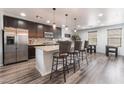 Modern kitchen with stainless steel appliances, a granite island, and stylish dark wood cabinetry at 4650 Ranch House Rd # 86, North Las Vegas, NV 89031