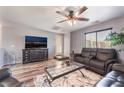 Comfortable living room featuring a ceiling fan, TV, and modern furnishings at 4650 Ranch House Rd # 86, North Las Vegas, NV 89031