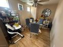 Dining area with round table, upholstered chairs, and decorative wall art at 5281 Starter Ave, Las Vegas, NV 89156