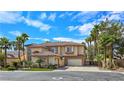 Elegant two-story home featuring a tiled roof, desert landscaping, and an attached two car garage at 5445 Pendini Point Ct, Las Vegas, NV 89141
