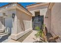 Close up of front door including a decorative iron gate leading to the front entrance at 5638 Wild Olive St, Las Vegas, NV 89118