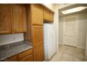 Ample storage with wood cabinetry and modern appliances against a neutral backdrop at 62 E Serene Ave # 129, Las Vegas, NV 89123