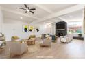 Bright living room featuring modern decor, a cozy fireplace, and ample natural light at 6205 Hargrove Ave, Las Vegas, NV 89107