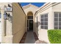 Close up view of the front entrance and door of the property at 7697 Morning Lake Dr, Las Vegas, NV 89131