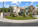 Corner lot home with manicured lawn, mature trees, and a convenient three-car garage at 7984 Laurena Ave, Las Vegas, NV 89147