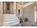 Inviting front entrance with decorative stone accents and steps leading to the front door at 9822 Opal Bridge Ct, Las Vegas, NV 89178