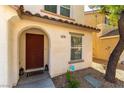Charming front entrance featuring a decorative door, stone details, and a welcome mat at 10254 Martinsburg Ct, Las Vegas, NV 89183