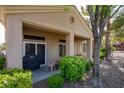 Charming covered back patio area with patio furniture and lush landscaping at 10720 Sky Meadows Ave, Las Vegas, NV 89134