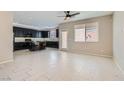 Open-concept living area featuring modern tile flooring, neutral walls, and a smooth flow into the kitchen at 10744 Yarmouth Bay Ct, Las Vegas, NV 89179
