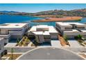 Picture-perfect aerial view showcasing modern homes on waterfront property with mountain views, and beautiful lake views at 1596 Pleasant Bay Ct, Henderson, NV 89011