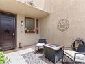 Inviting outdoor courtyard with seating area, perfect for relaxing or entertaining at 1604 Patrick Thomas Ct, North Las Vegas, NV 89086