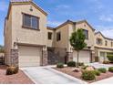 Beautiful townhome featuring desert landscaping, stone accents, and private gated entry, located in a desirable neighborhood at 1604 Patrick Thomas Ct, North Las Vegas, NV 89086