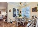 Bright dining area features plantation shutters and hardwood floors; the perfect space for Gathering meals at 2050 W Warm Springs Rd # 3211, Henderson, NV 89014