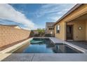 Inviting backyard pool with a serene view, perfect for relaxing and entertaining near the back patio at 262 Inflection St, Henderson, NV 89011