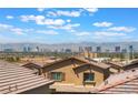 Expansive city view featuring a sprawling community of homes with the Las Vegas skyline and mountains in the background at 2767 Lindsey Springs St, Las Vegas, NV 89142