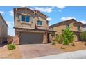 Charming two-story home featuring a paved driveway, neutral stucco exterior, and an attached two-car garage at 2767 Lindsey Springs St, Las Vegas, NV 89142