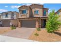 Charming two-story home featuring a paved driveway, neutral stucco exterior, and an attached two-car garage at 2767 Lindsey Springs St, Las Vegas, NV 89142