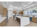 Modern kitchen featuring a large center island, stainless steel appliances, and stylish cabinetry at 2826 Barrow Downs St, Las Vegas, NV 89135