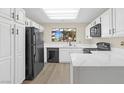 Modern kitchen with white cabinets, sleek countertops, and black appliances for a stylish and functional space at 2851 S Valley View Blvd # 1195, Las Vegas, NV 89102