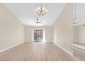 Bright and spacious living room with contemporary flooring, fan, and glass doors opening to the outdoors at 2851 S Valley View Blvd # 1195, Las Vegas, NV 89102
