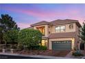 Beautiful home featuring a two-car garage and meticulously manicured desert landscape at 3010 Hammerwood Dr, Las Vegas, NV 89135