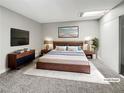 Comfortable primary bedroom with a modern bed, skylight, and a large TV for ultimate relaxation at 3142 Espanol Dr, Las Vegas, NV 89121