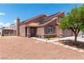 This two-story home features a cozy, enclosed backyard and drought-resistant landscaping at 3547 Empress Diamond Dr, North Las Vegas, NV 89032