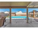 Inviting backyard pool view from covered patio, great for outdoor lounging and entertaining at 3547 Empress Diamond Dr, North Las Vegas, NV 89032