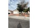 Single story home with drought-tolerant landscaping, featuring a two-car garage at 3729 Bronco Billy Ct, Las Vegas, NV 89129