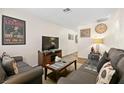 Cozy living room features a large television, comfortable seating, and natural light at 3982 Voxna St, Las Vegas, NV 89119
