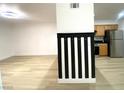Bright living area with modern flooring and custom-designed column at 4248 Tara Ave # 2, Las Vegas, NV 89102