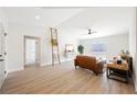 Bright living room featuring modern decor, wood floors, and access to the backyard at 427 Wright Way, Henderson, NV 89015