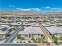 A bird's eye view of a Primary-planned community, surrounded by desert landscape and mountain views at 4277 Sunrise Flats St, Las Vegas, NV 89135
