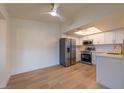 Bright kitchen featuring stainless steel appliances, white cabinetry, and quartz countertops at 5040 Spencer St # D, Las Vegas, NV 89119