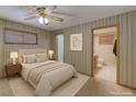 Cozy bedroom with soft lighting, calm colors, and convenient access to a private bathroom at 5262 Harris Ave, Las Vegas, NV 89110
