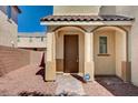 Covered front porch featuring brick pavers, and columns in front of the front door at 5852 Brown Tree Ln, North Las Vegas, NV 89081