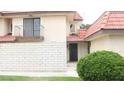 A two-story home features a private balcony and well-maintained landscaping at 721 Bourbon St # F2, Pahrump, NV 89048