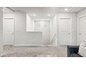 Upstairs landing featuring neutral carpet and paint, as well as convenient access to all rooms at 7819 Rachelis St, North Las Vegas, NV 89084