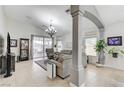 Inviting living room with tile flooring, a ceiling fan, and access to the outdoor patio at 8250 Lincoln Valley St, Las Vegas, NV 89123