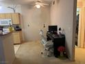 An ample living space with neutral carpeting; featuring an adjacent desk and workspace at 8250 N Grand Canyon Dr # 2154, Las Vegas, NV 89166