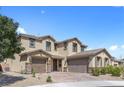 Spacious home boasting a three-car garage, charming curb appeal, and meticulous landscaping at 8953 Hitch Creek St, Las Vegas, NV 89131