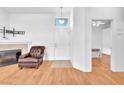 Entryway boasts hardwood floors, white walls, and a door to the bedroom at 8985 S Durango Dr # 1110, Las Vegas, NV 89113