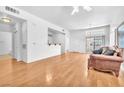 Open-concept living room with hardwood floors and access to the patio at 8985 S Durango Dr # 1110, Las Vegas, NV 89113