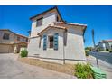 Exterior side view of home with partial view of street at 9165 Starling Wing Pl, Las Vegas, NV 89143