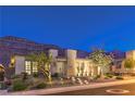 Beautifully landscaped home features a lighted walkway and desert landscaping at 10149 Terrastone Dr, Las Vegas, NV 89148