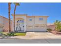 Charming two-story home boasting well-kept landscaping, a three-car garage, and beautiful architectural details at 1035 Tabor Hill Ave, Henderson, NV 89074