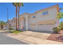Attractive home with a well-maintained yard, spacious driveway, and a welcoming entrance with decorative touches at 1035 Tabor Hill Ave, Henderson, NV 89074